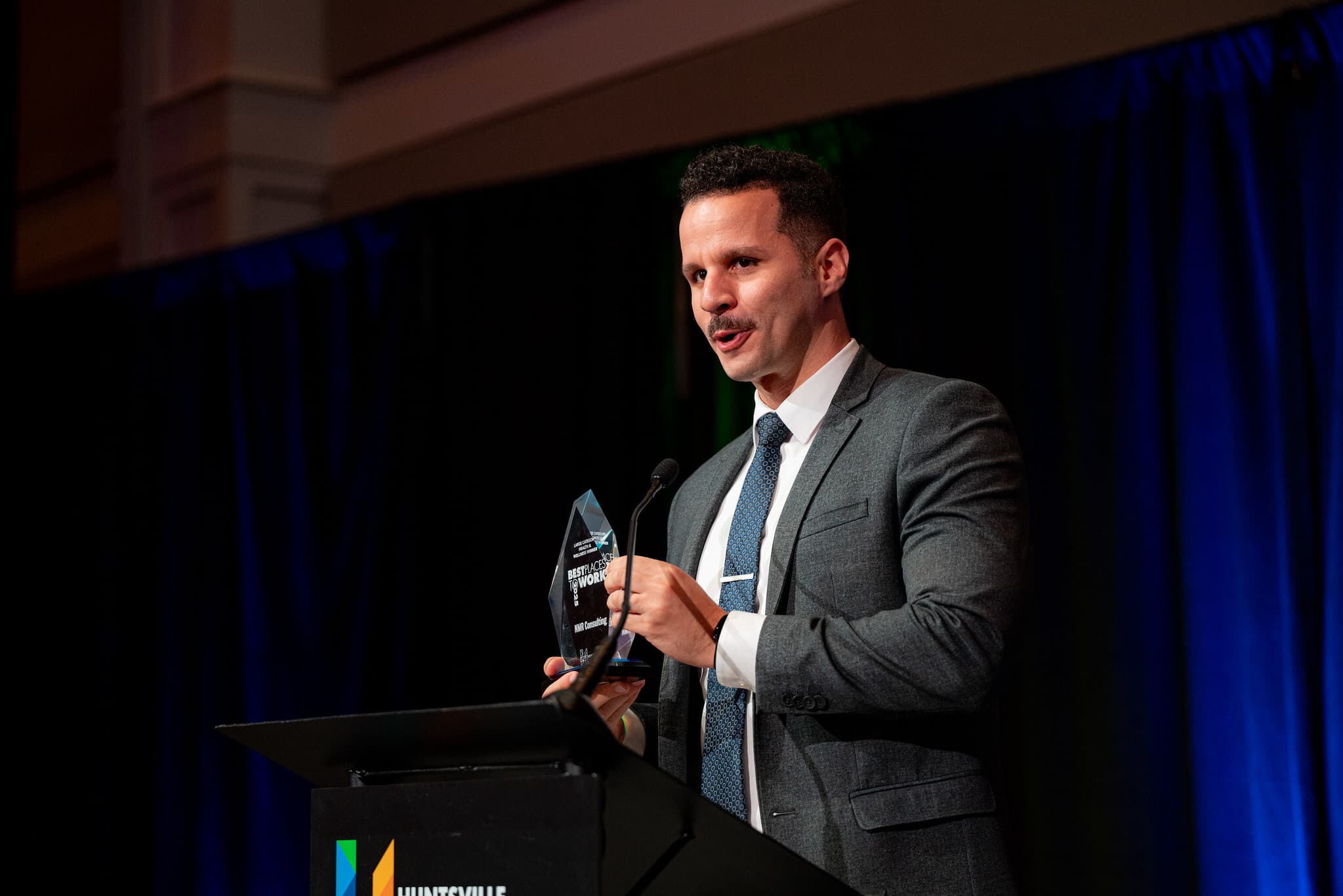 Lionel B. accepting the Health & Wellness award on behalf of NMR.